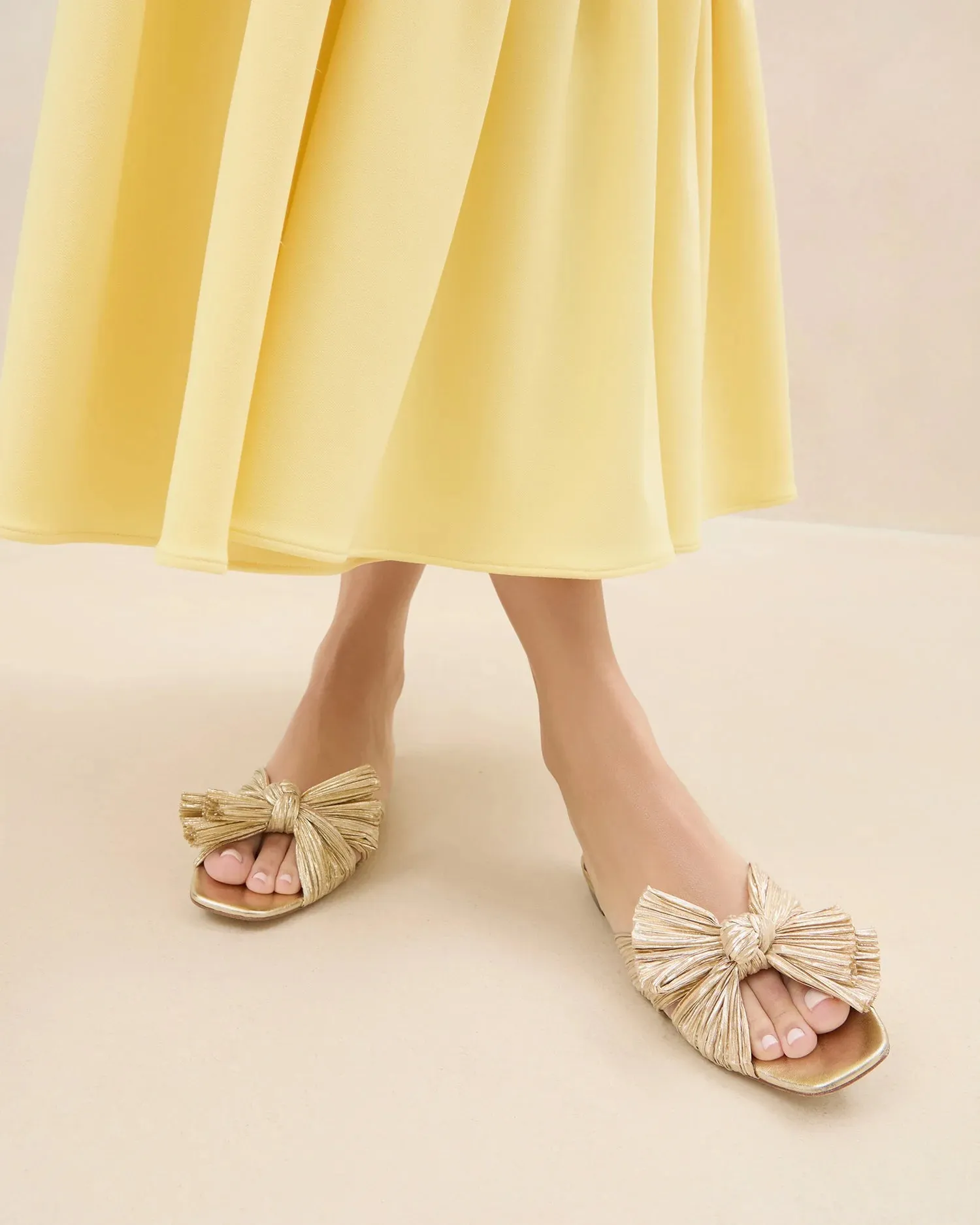 Effortless Elegance Metallic Pleat Bow Sandals