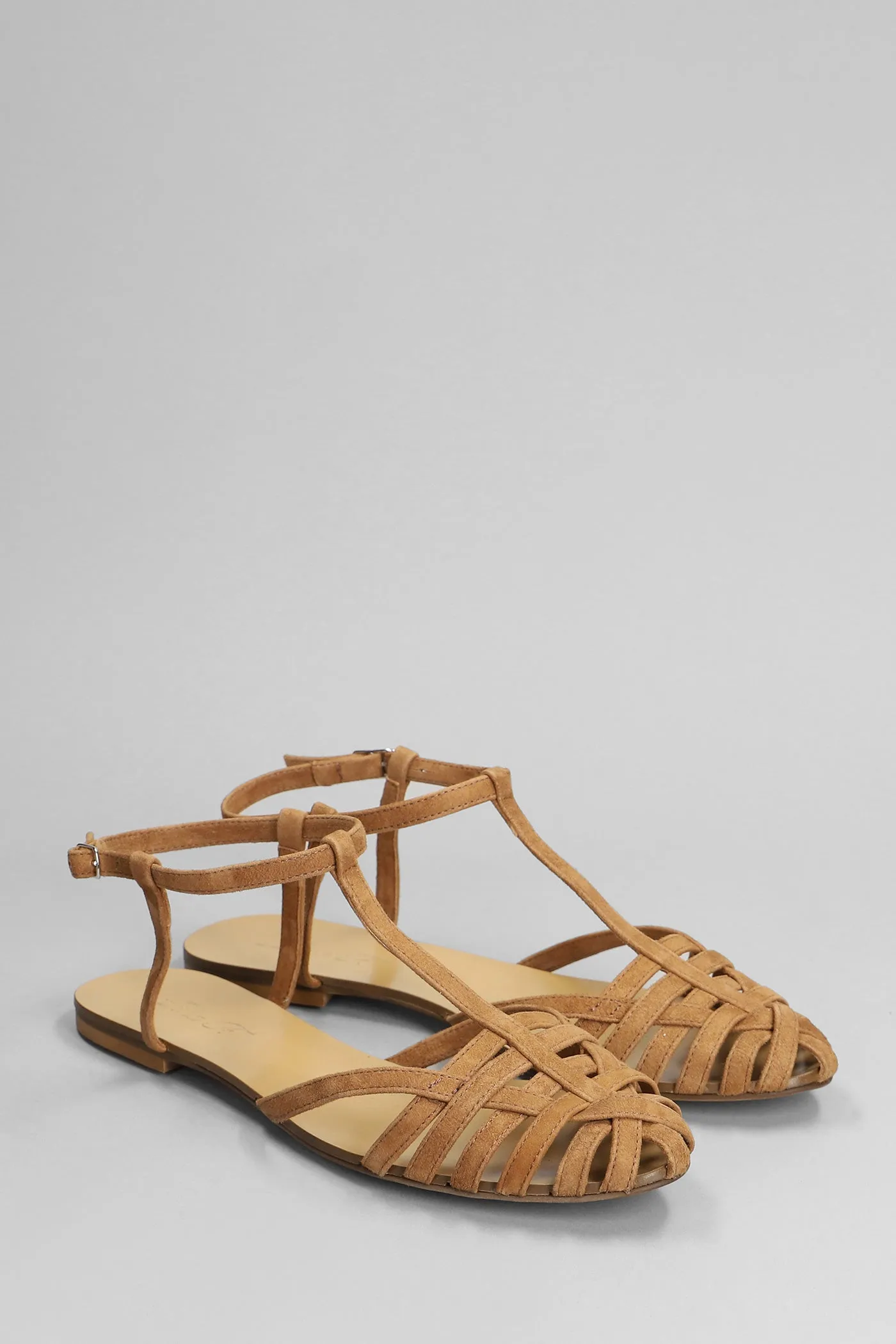 Flats in brown suede